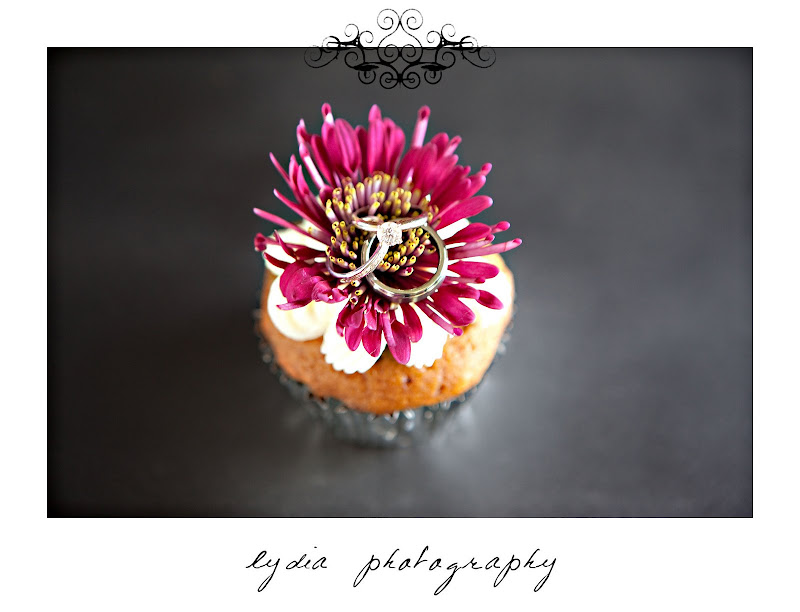 Bride's and groom's rings on a cupcake at purple, winter wedding in Santa Rosa, California