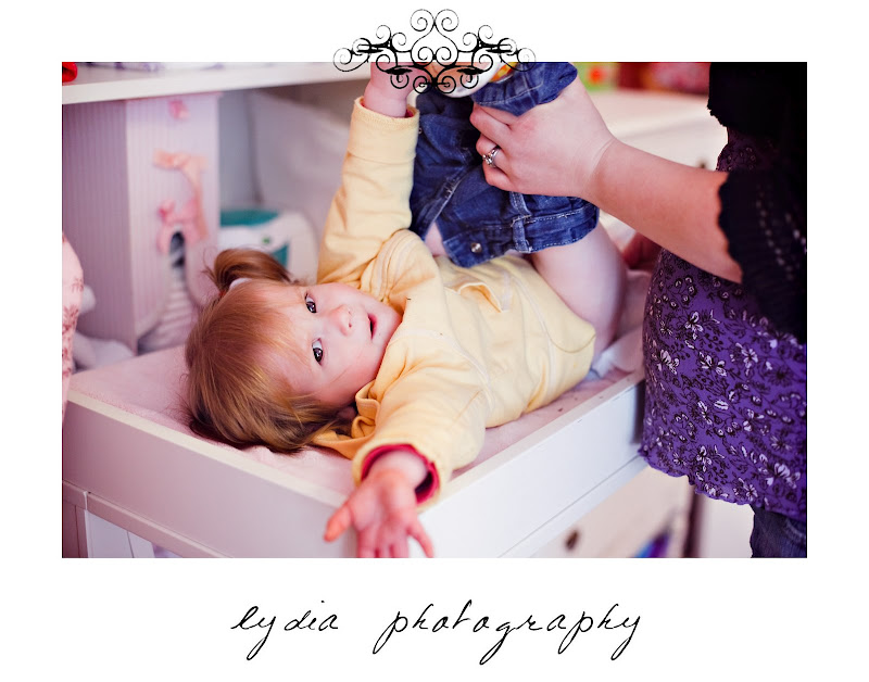 Little girl getting changed at lifestyle maternity portraits in Grass Valley, California