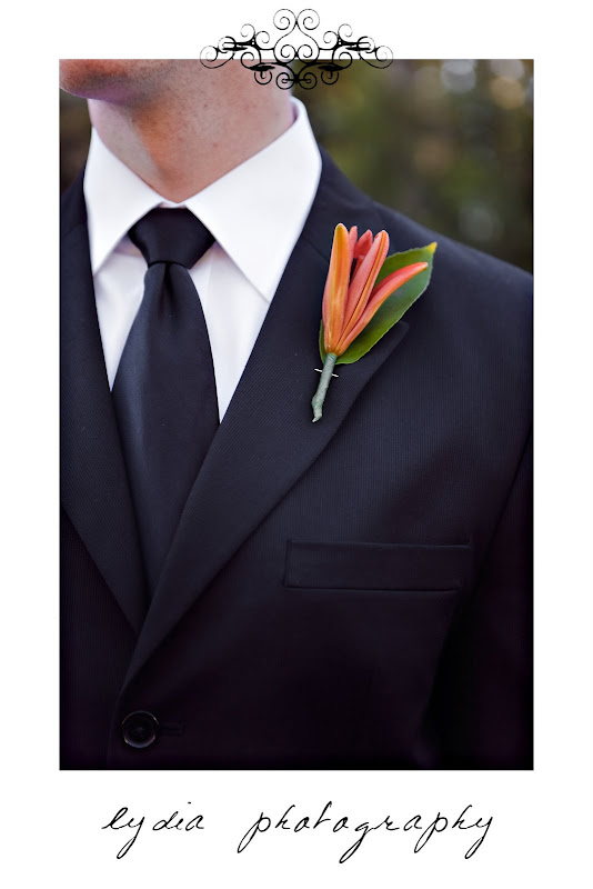 Groom's boutonniere at snowy, green and orange wedding in Shingletown, California