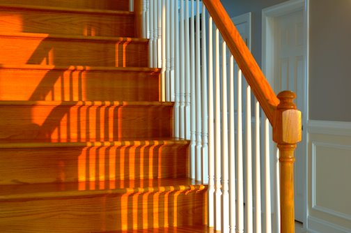 the warmth of wooden stairs in foyer