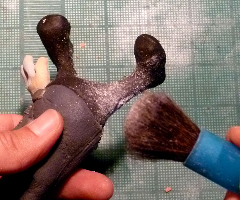To prevent this grab the makeup brush and dust the puppet generously with To prevent this grab the makeup brush and dust the puppet generously with