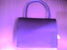 Bolso de raso morado pvp 8€.