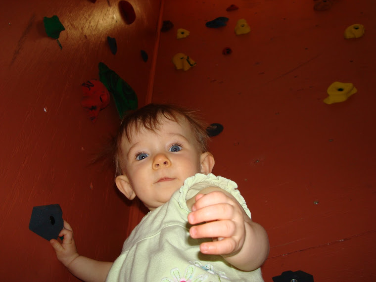 Daddy is teaching me how to rock climb!!