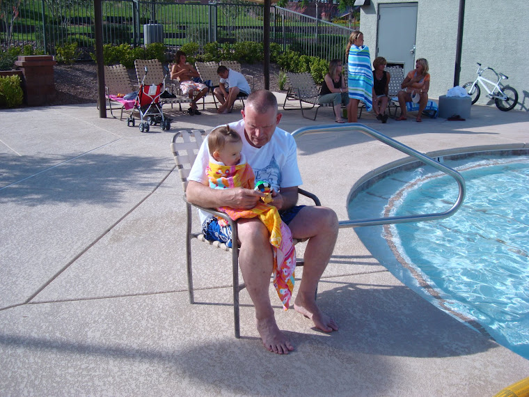Grandpa was keeping me warm after I got done swimming all over the pool!