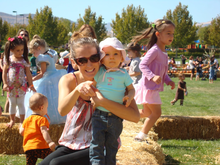 Playing on the hay at the pumkin festival