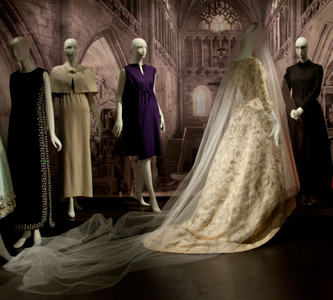View of a white lace wedding dress exhibited in the Balenciaga