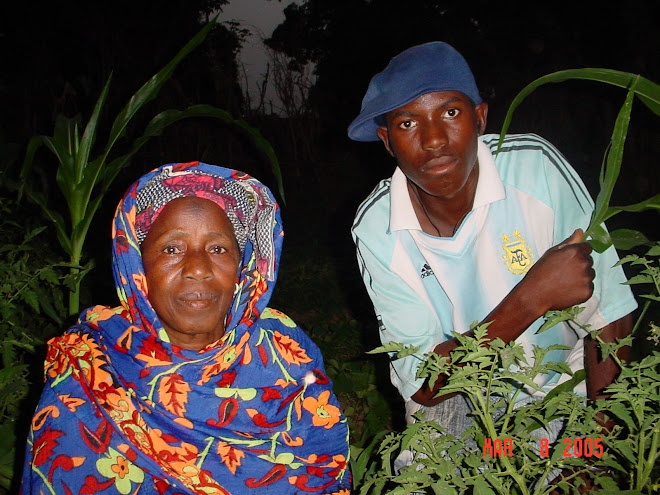 Lansana and his grandmother in their garden