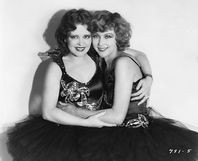 Clara Bow and Joyce Compton share a hug.