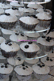 Cupcake tower with a black and white theme.