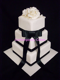 3 tier square stacked with white sugar roses.