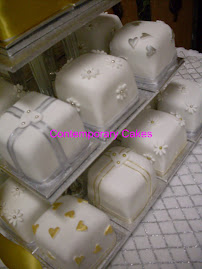 Silver and gold theme miniature square  cakes.