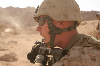Lance Cpl. Kevin P. Herron, a Checotah, Okla. native and fire team leader with Light Armored Reconnaissance Platoon, shouts out 