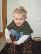 Trying on Daddy's boots