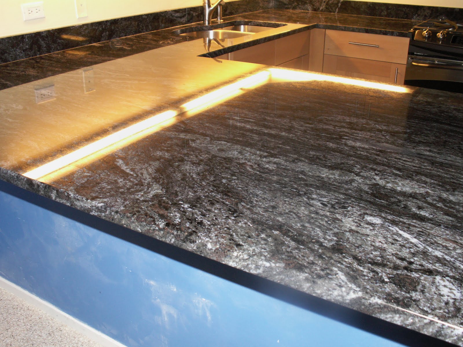 JC Granite: Dynamic Blue Granite with eased edge profile.