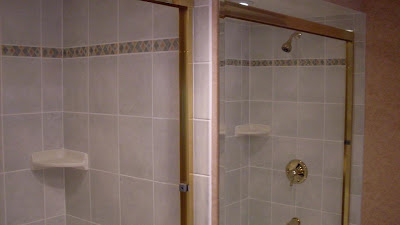 ceramic tile surround with inset border tiles over air-jet tub