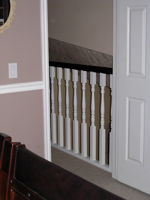 How the top Banister looks from my Bedroom. :)  A million times better than the plain oak.