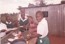 Faces of smilling children savoring a hearty meal