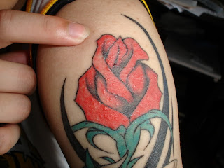 Tribal Tattoo Combination with red Rose very nice designtribal tattoo combination with red rose very nice design 