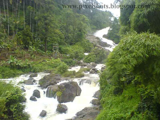 Milky Stream of Water through rocky river course,snapped on the way to Munnar hillstation river stream through rocks,water falls scenery on the way to munnar hillstation of kerala,moonar tour trip photos