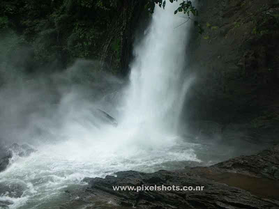 sooshipara=waterfalls photograph from wayanadu=kerala-india,a photo of water splashing on the rocks below,kerala's waterfalls