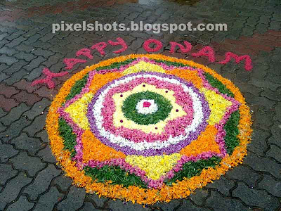 athapookkalam during onam in kerala,flower decorations in onam kerala,athapookalam in onam photographed from a flower laying ,athapookala competition held in kerala