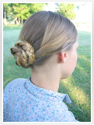 [Women in dresses, England, 1890s.] A quick and simple 1860s hairstyle.