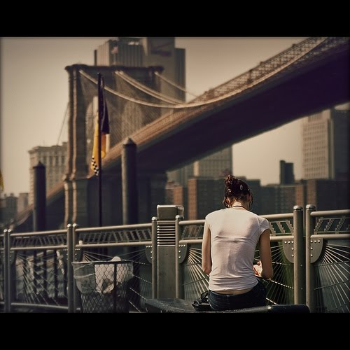 [a+girl+reading+on+Brooklyn+Bridge+via+overflowing.jpg]