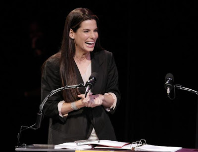 Sandra Bullock accepts worst actress honors at the Razzie Awards on Saturday 