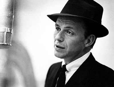 black and white man in suit and hat