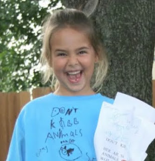 Photo: A young child passionate about her work.