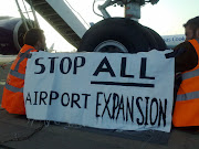 A second group used tripods to blockade the road entrance to the World . (banner )