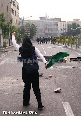 a woman challenges police in tehran