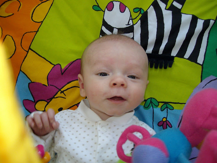 Coop playing on his activity mat