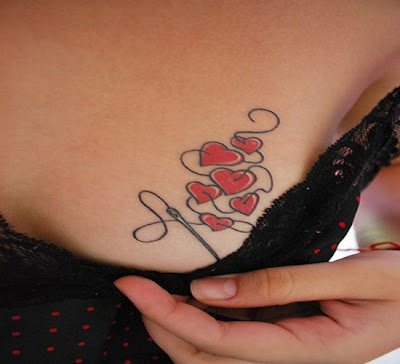 Little needled hearts tattoo on the breast looks simply awesome, 