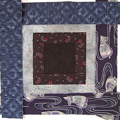 God's Eye quilt by Robin Atkins, auditioning fabrics, 2 choices