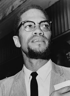 Malcolm X head-and-shoulders portrait, facing right
