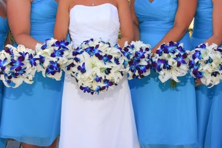 The blue orchids in these bridal and bridesmaids bouquets really stand out