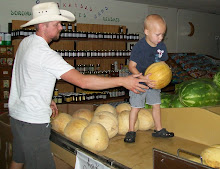 Riles helping with the cantaloupe display