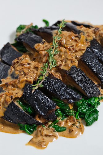 Grilled Portobello Mushroom in a Porcini Cream Sauce on a bed of Spinach