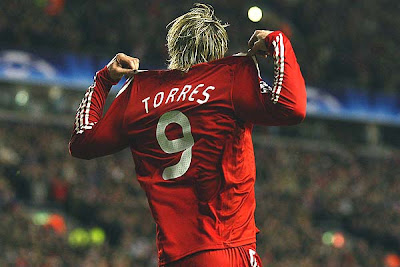Fernando Torres of Liverpool celebrates scoring the opening goal against Real Madrid.