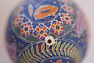 Goose Egg Pysanky with Orange Poppies and Peacocks on Cobalt Blue Background