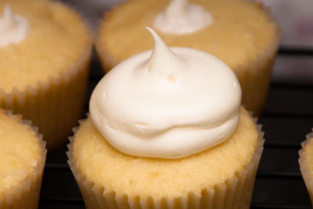 A Dose of Frosting.. Coconut Cream filled Coconut Cupcakes with Cream