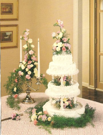 The wedding cake The bride and the groom cut the cake Christmas lights are