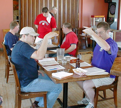 Near table: Judges Jason Johnson and Richard Stueven. Far table: Judges Jeff Bushner and David Malcolm. Background: Stewards Ryan Loock and Bob Ferguson