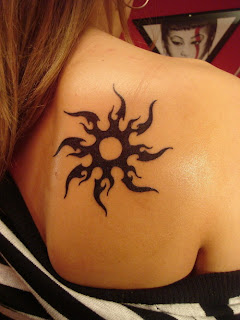 Lower back tribal Sun tattoos - For Girls 