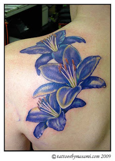 Flower Tattoos in back body girl