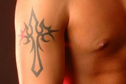 tribal cross arm tattoos design