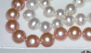 Paula's two strands of pearls. One strand of 9-10 mm white, and a strand of 10-11 mm pastel.