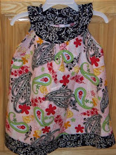 Rounded neck top that buttons on the shoulder- Starting at $32