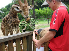 Papa and Sydney feeding the giraffe